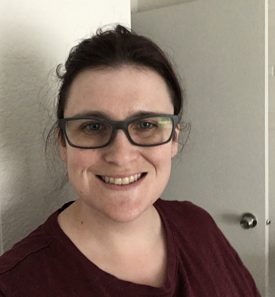 Rebecca Deitch smiling in a professional setting